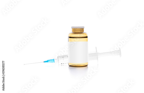 Syringe and injection in a bottle on a white background.
