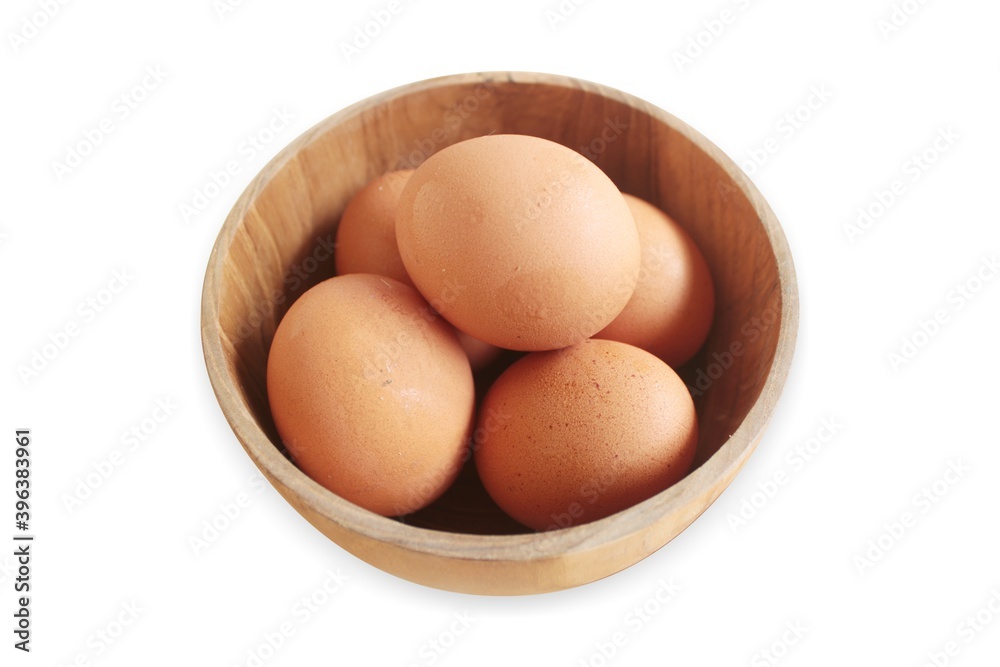 duck eggs in a wooden bowl on a white background