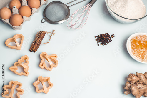 Shortcrust pastry for gingerbread.Christmas background for baking, top down view, copy space. Christmas and New Years, family celebration traditions. cinnamon, spices, flour on a white table.