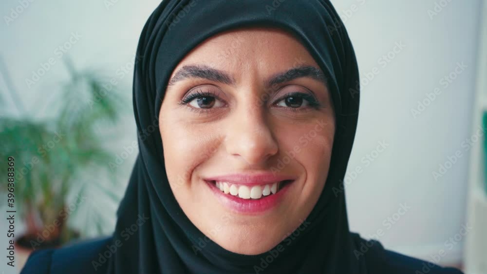 Portrait of muslim woman smiling at camera