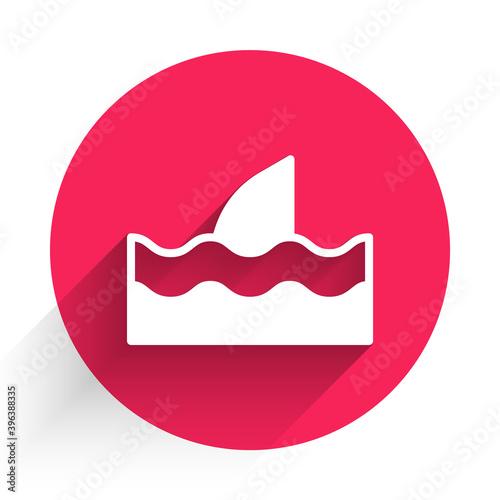 White Shark fin in ocean wave icon isolated with long shadow. Red circle button. Vector.
