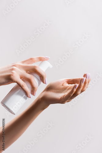 cropped view of woman applying cleansing foam isolated on grey, stock image © LIGHTFIELD STUDIOS