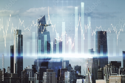 Abstract virtual financial graph hologram on New York cityscape background, financial and trading concept. Multiexposure