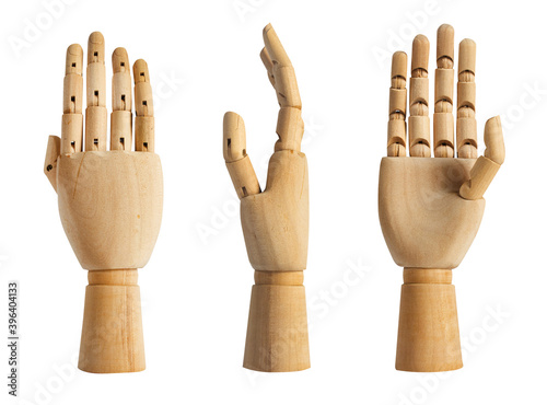 Isolated photo of a wooden mannequin hand in different angles on white background.