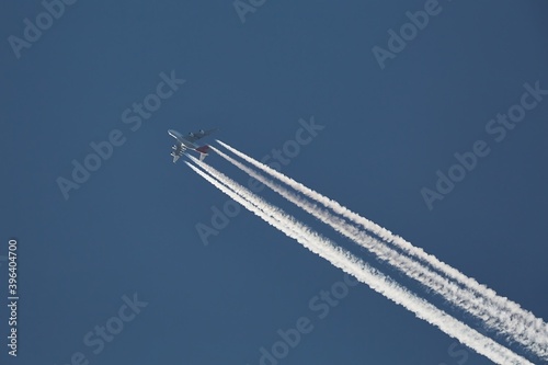Plane at cruising altitude against blue sky