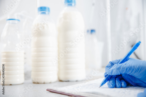 Quality control test of milk in laboratory. Dairy factory industry products