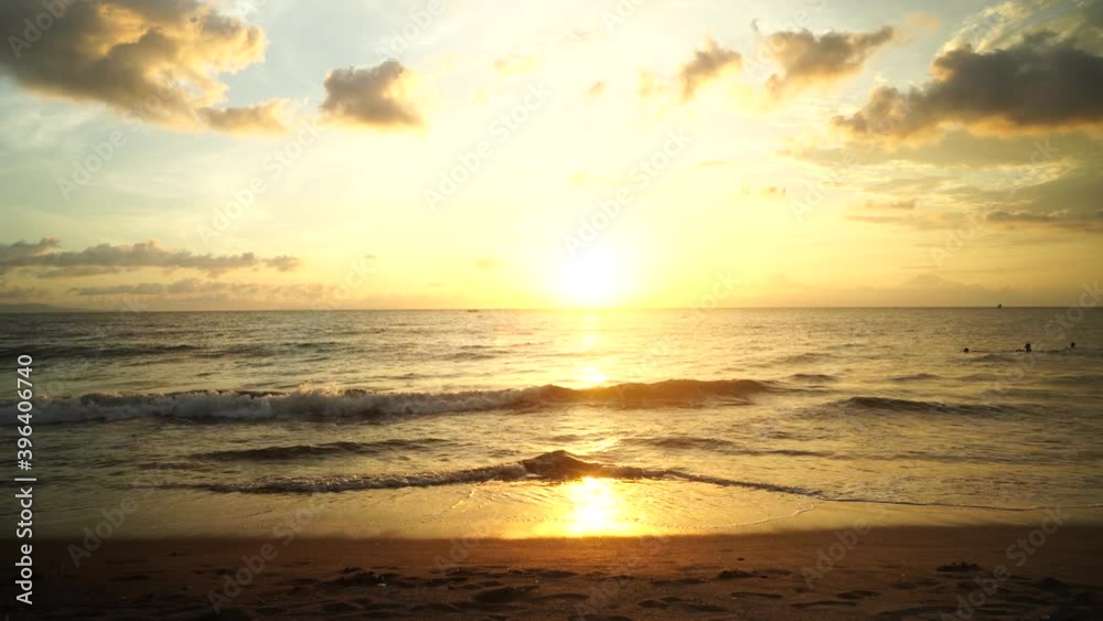 Bali Indonesia December 3, 2020: the sun sets on a beautiful beach with an orange sky Bali Indonesia December 3, 2020: the sun sets on a beautiful beach with an orange sky