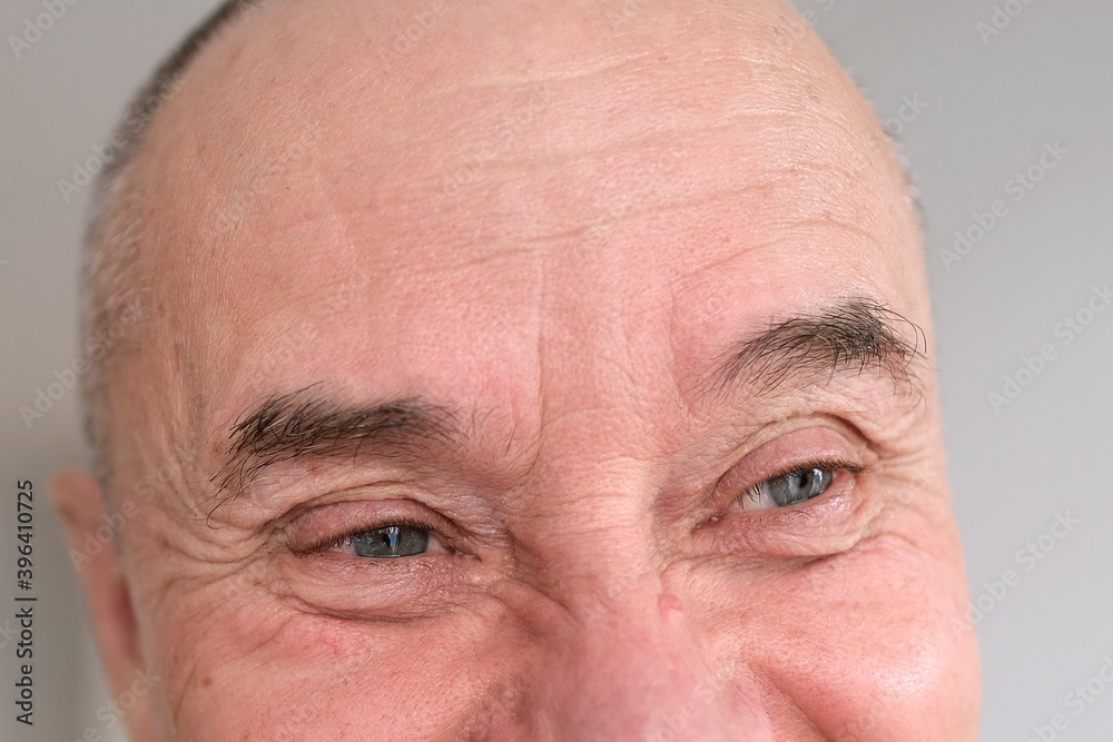 eyes, forehead of elderly man close-up, concept of restoration of human vision, health of optic nerve, nervous tic, myopia, hyperopia, vision test, anti-aging procedures, human emotions eyes, forehead of elderly man close-up, concept of restoration of human vision, health of optic nerve, nervous tic, myopia, hyperopia, vision test, anti-aging procedures, human emotions