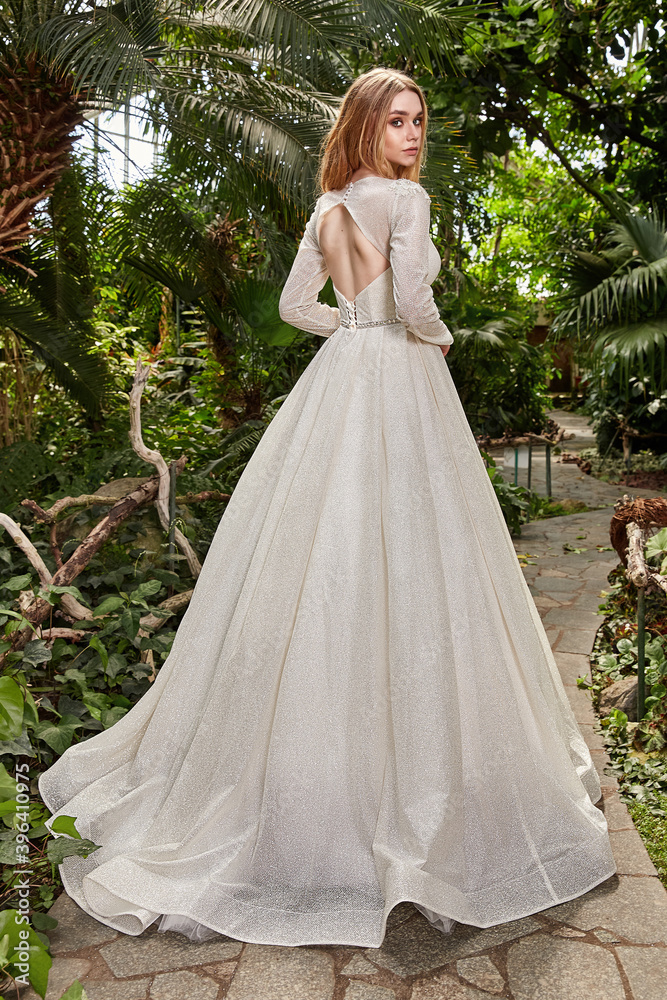 Sexy beautiful woman pretty bride wedding big day marriage ceremony in summer garden wearing long silk and lace white dress bright makeup hairstyle pure love. Sexy beautiful woman pretty bride wedding big day marriage ceremony in summer garden wearing long silk and lace white dress bright makeup hairstyle pure love.