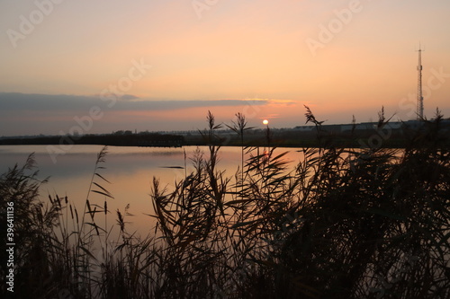 Sunset over the river Rotte in Zevenhuizen with windmills of the Molenviergang