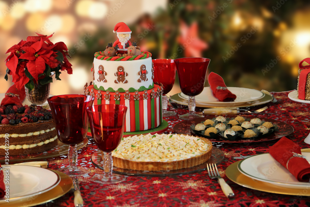 Christmas sweets and cakes. Decorate table with delicious Christmas sweets, chocolate and candys. Santa Claus, bear and others Christmas sweets and cakes. Decorate table with delicious Christmas sweets, chocolate and candys. Santa Claus, bear and others