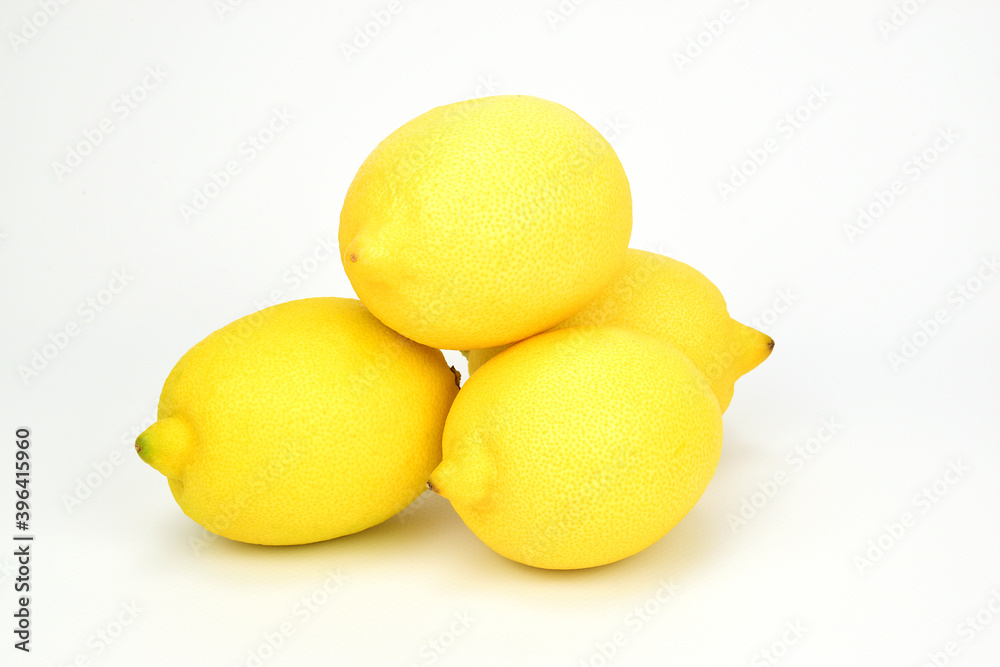Small heap of yellow ripe lemons isolated on a white background. Small heap of yellow ripe lemons isolated on a white background.