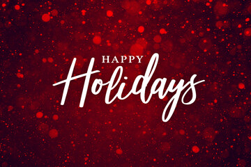 Happy Holidays Text Over Festive Red Sparkle Glitter Background. Magical Christmas Calligraphy Font with Glowing Bokeh Lights Backdrop. Holiday Party Card Design with Elegant Snow Particle Texture.