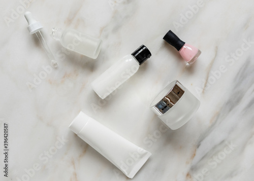 flat lay of beauty products, cream, bottle, dropper bottle, nail polish, white, pink, beauty blog 