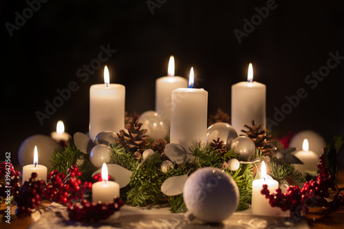 Advent wreath with burning candles christmas balls and decorations