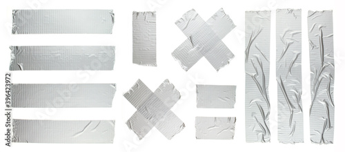 Foto Set of different size silver grey adhesive tape on white background