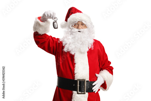 Santa Claus holding showing car keys and smiling