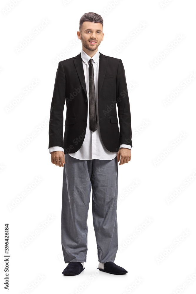 Full length portrait of a young modern businessman in a suit and pajamas Full length portrait of a young modern businessman in a suit and pajamas