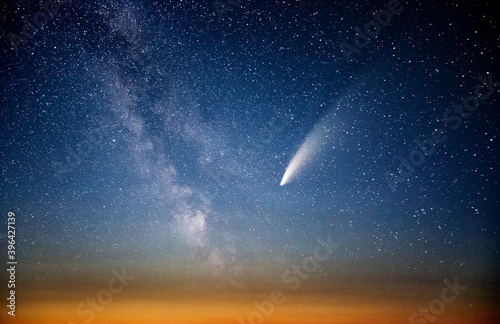 Wonderful view of starry sky and C/2020 F3 (NEOWISE) comet with light tail. photo