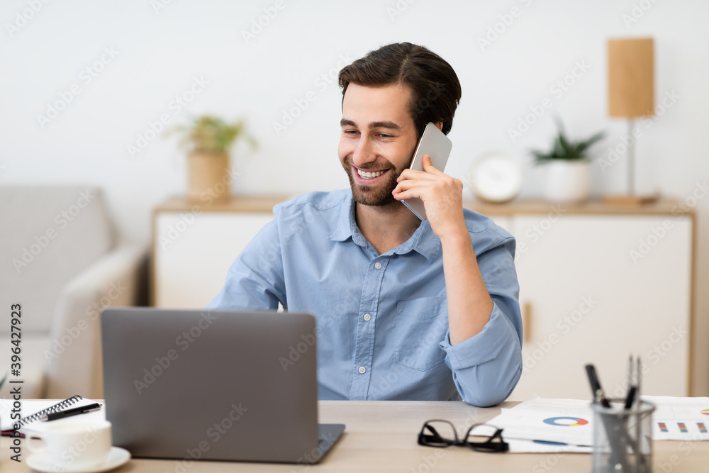 Gladful Man Talking On Phone Working Sitting In Office