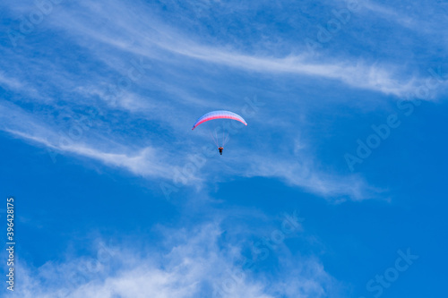 paragliding in the blue sky