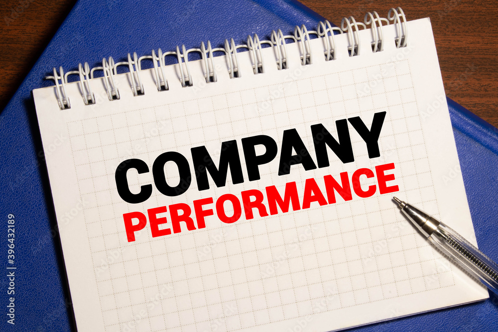 White paper with text concept word COMPANY PERFORMANCE on the office table White paper with text concept word COMPANY PERFORMANCE on the office table