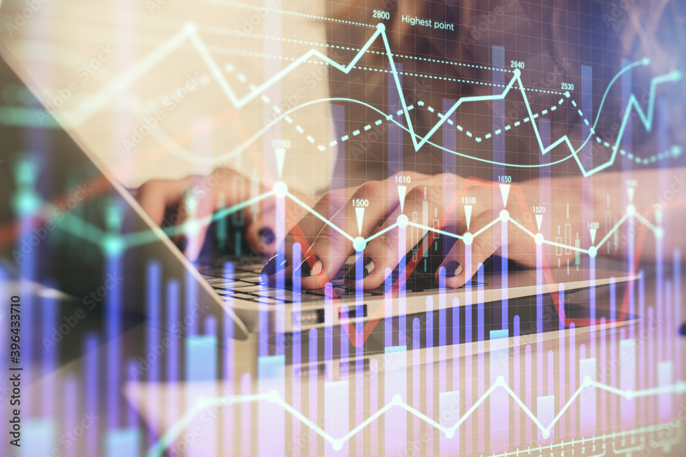 Double exposure of woman hands typing on computer and forex chart hologram drawing. Stock market invest concept. Double exposure of woman hands typing on computer and forex chart hologram drawing. Stock market invest concept.