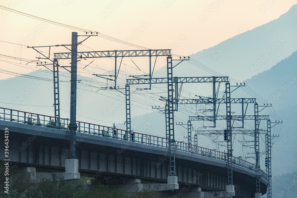 Railway bridge on mountain background at sunrise time. Railway bridge on mountain background at sunrise time.