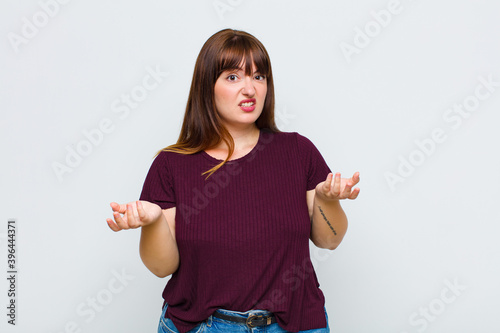 overweight woman feeling clueless and confused, not sure which choice or option to pick, wondering