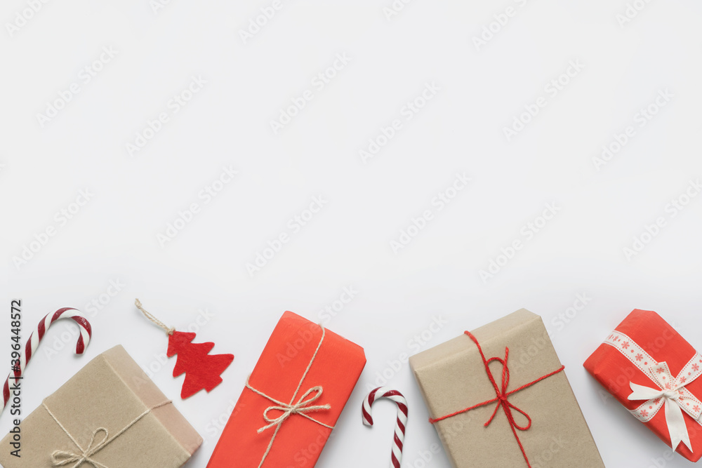 Christmas gift decoration flat lay red and white composition with empty place for text. New Year and X-mas holidays concept.