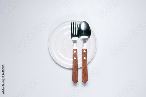 Top view of Empty round dinner plate  on white background