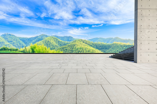 Empty square floor and green mountain with bamboo forest natural landscape.