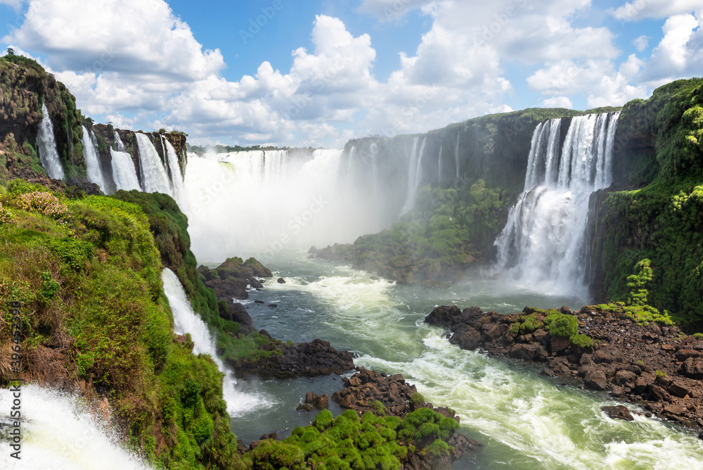 Natural landscape of Cataratas do Iguaçu, also know as Iguazu Waterfalls in the border of Brazil and Argentina. Devil's Throat water fall visible with huge flow of water from Paraná River. 