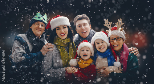 Portrait of loving family on dark snowy background