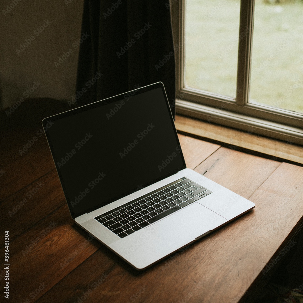 Digital laptop on a wooden table Digital laptop on a wooden table