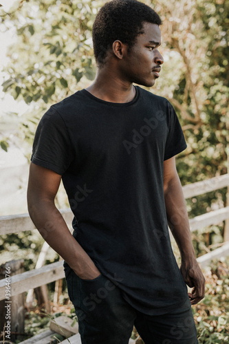 African American man in black t-shirt mockup outdoors