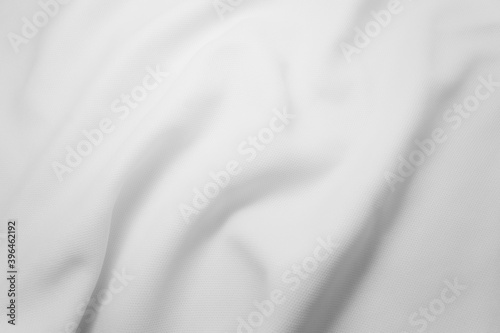 Rippled white cloth background. Fabric texture.