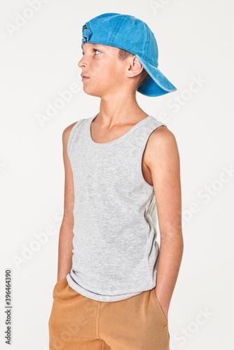 Boy&#39;s gray tank top and blue cap