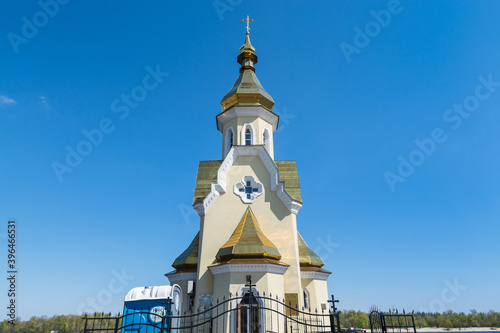 St. Nicolas Wondermaker on The Water Church at the Dnieper River against blue sky in Kiev, Ukrain.