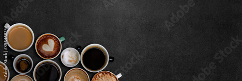 Coffee cups on a black textured wallpaper.