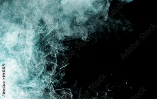 gray smoke with a blue tint on a black background
