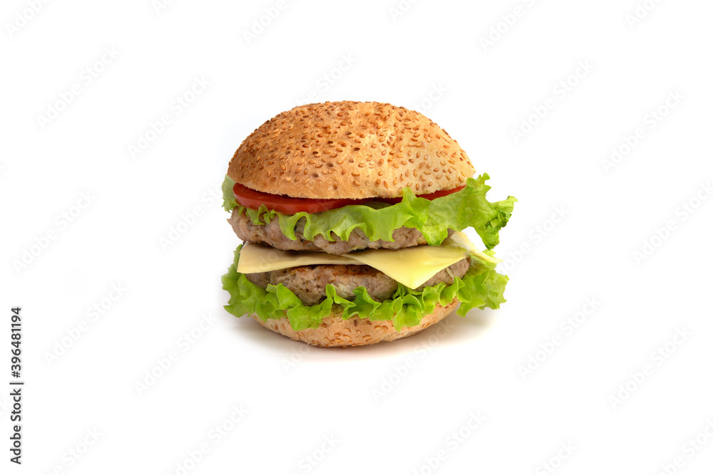 Double burger with cheese, tomato and lettuce on white table against white background Double burger with cheese, tomato and lettuce on white table against white background
