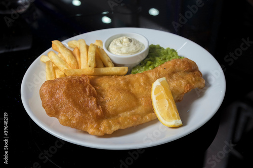 Fish and Chips with mashed peas, French fries and sauce tartar