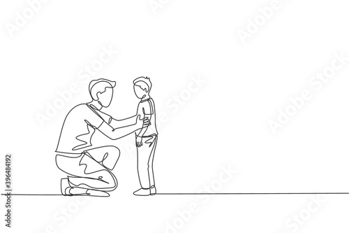 One continuous line drawing of young father giving some wise advice talk to his son at home, family life. Happy parenting concept. Dynamic single line draw graphic design vector illustration