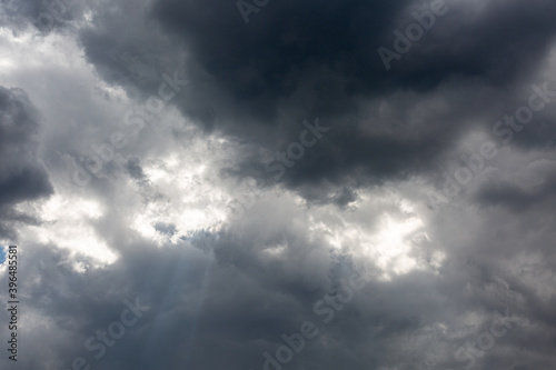 Dark sky and clouds with light beams