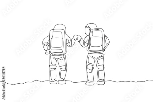 One continuous line drawing of two young happy astronauts giving fist bump gesture in moon surface, rear view. Space man deep space concept. Dynamic single line draw design vector graphic illustration