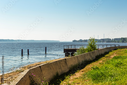 a small pier on the bank of the Volga River in the warm summer