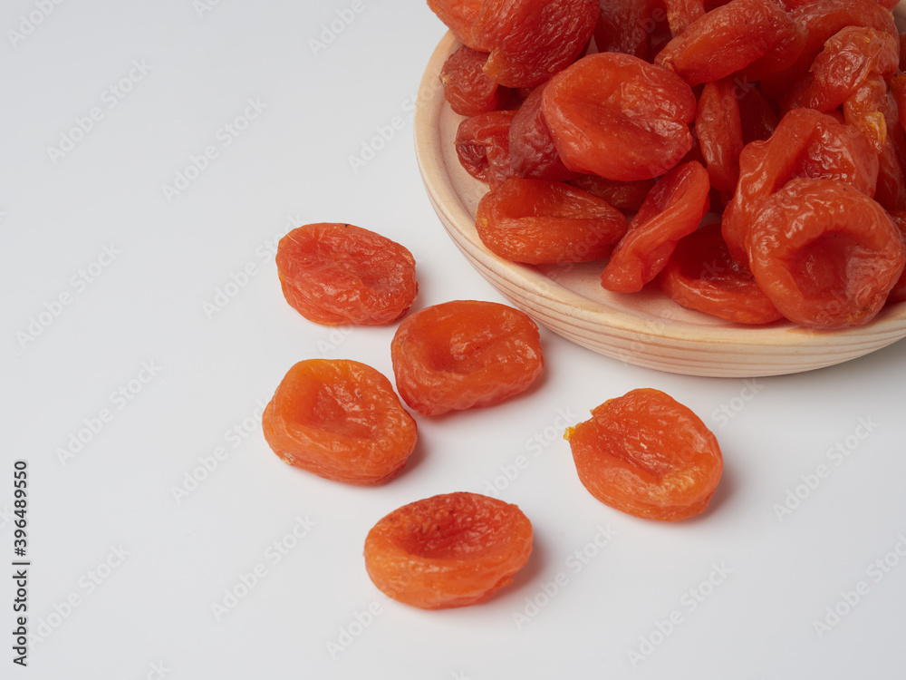 Dried apricot fruit forming a background. Dried apricot fruit forming a background.