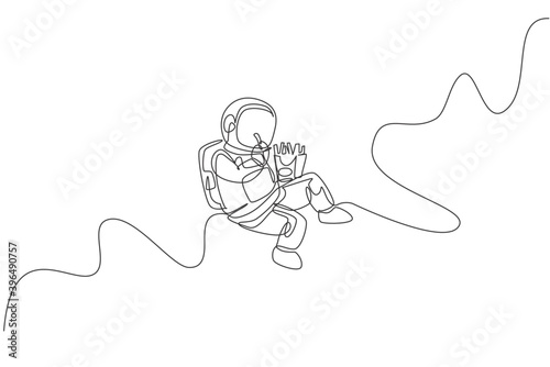 One single line drawing of astronaut flying in cosmos galaxy while eating french fries vector graphic illustration. Fantasy outer space life concept. Modern continuous line draw design