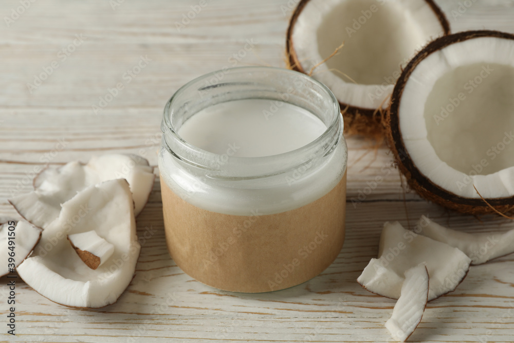 Fresh coconut and coconut milk on wooden background Fresh coconut and coconut milk on wooden background
